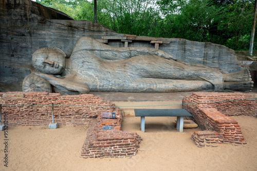 The reclining Buddha statue of Gal Vihara at the ancient site of Polonnaruwa in Sri Lanka. It is carved out of a single slab of granite rock. photo