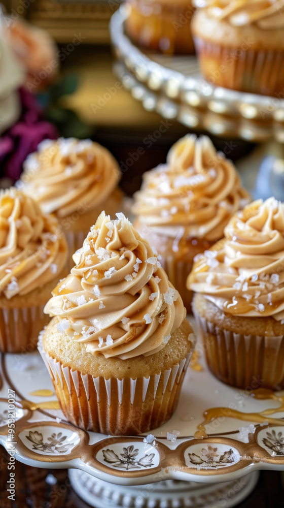 Salted Caramel Cupcakes with Buttercream, Sea Salt Flakes, and Caramel Drizzle on a Vintage Platter Salted Caramel Cupcakes with Buttercream, Sea Salt Flakes, and Caramel Drizzle on a Vintage Platter