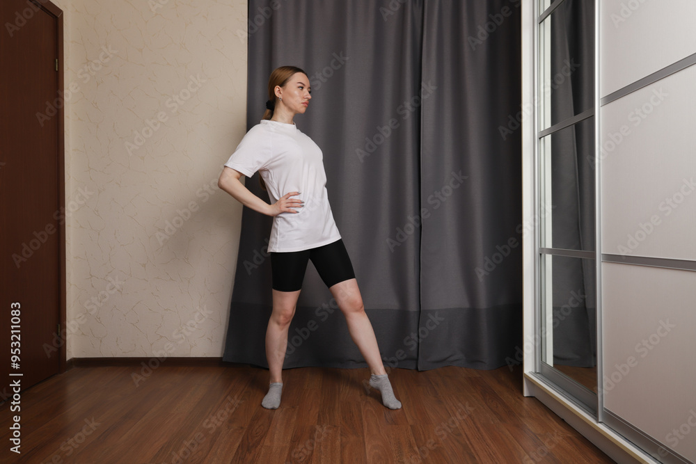 Fototapeta premium Teenage girl dancing at home, youth in motion exercising indoors, active lifestyle with music and fun