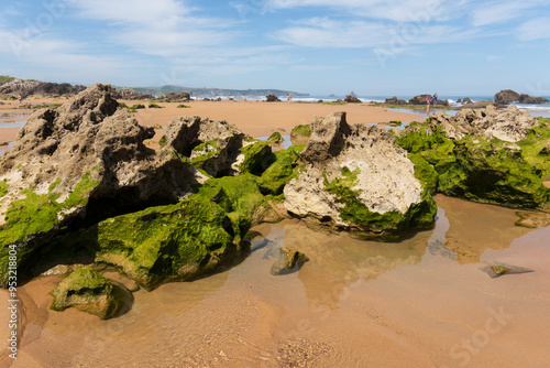 Canallave beach in Pielagos Cantabria Spain      morning of summer with low tide, Liencres dunes natural park. photo