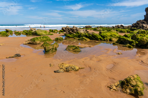 Canallave beach in Pielagos Cantabria Spain      orning of summer with low tide, Liencres dunes natural park. photo