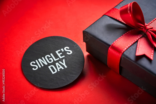 Single'S Day Gift Box With Red Ribbon On Red Background. photo