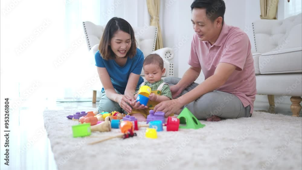 Parents and their little child play happily in the living room of the house Parents and their little child play happily in the living room of the house