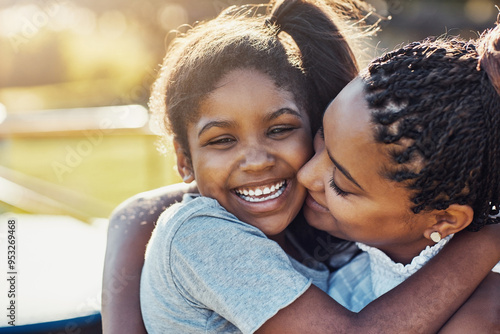 Mom, hug and kiss happy kid at park for love, support and care with family. African mother, child and embrace girl at playground for connection, adoption and laughing with parent on holiday outdoor photo