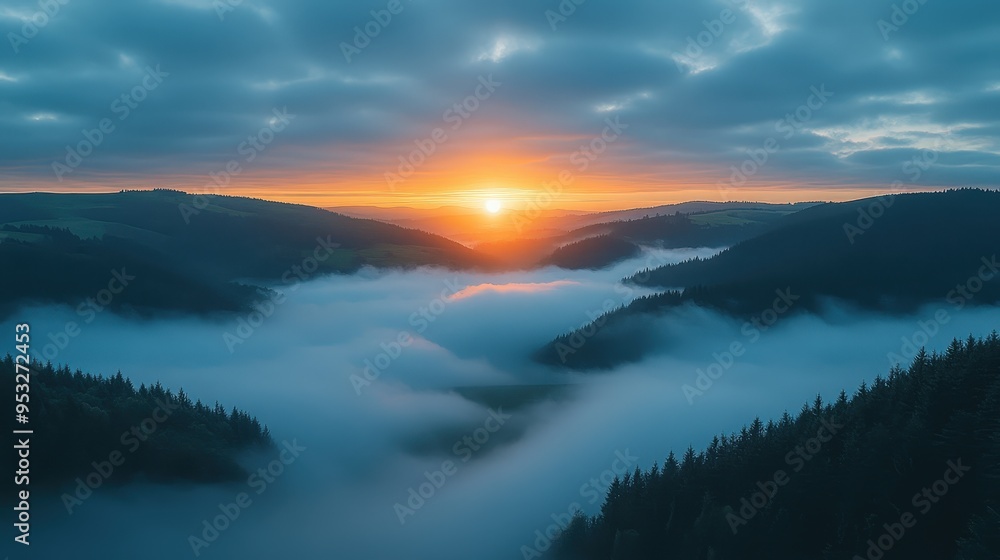 Obraz premium Sunrise Over Foggy Mountain Valley.