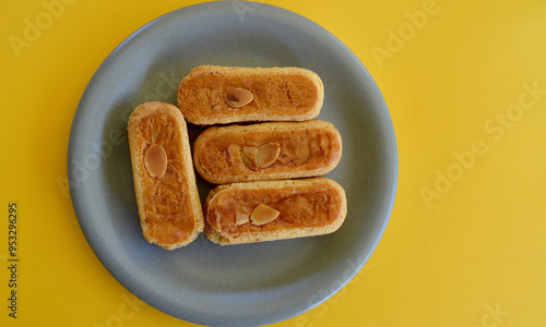 Delicious almond finger biscuits on the table.