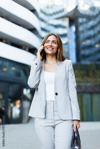 Confident businesswoman wal...