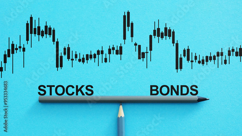 Cuadro en lienzo Stocks and bonds balancing on a scale as business and financial concept