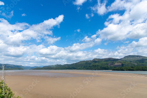 High level panoramic view over sandbanks in the Mawddach Estuary near Barmouth, UK  with rolling hillss and white clouded blue sky photo