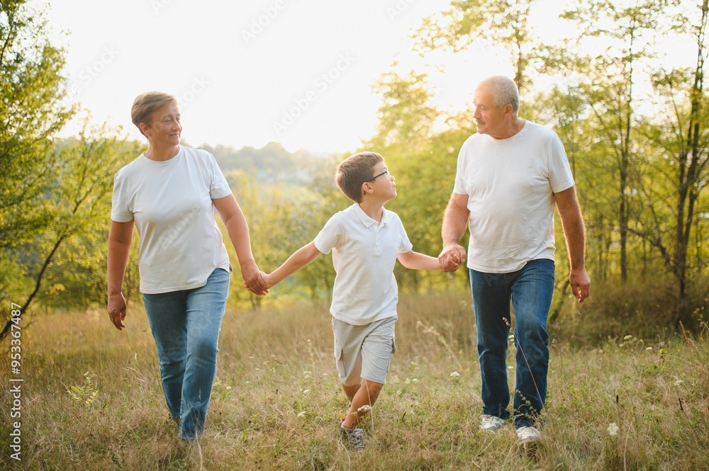Grandparents and grandson together in autumn park Grandparents and grandson together in autumn park