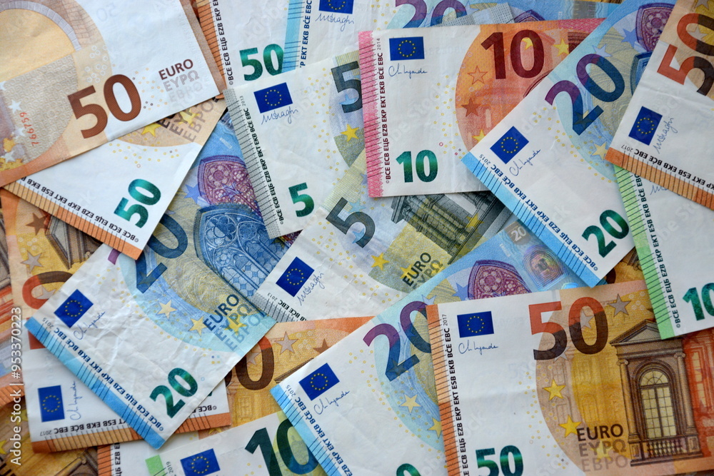 Many european euro money bills in chaotic arrangement. Pile of eur banknotes with different colors and condition Many european euro money bills in chaotic arrangement. Pile of eur banknotes with different colors and condition