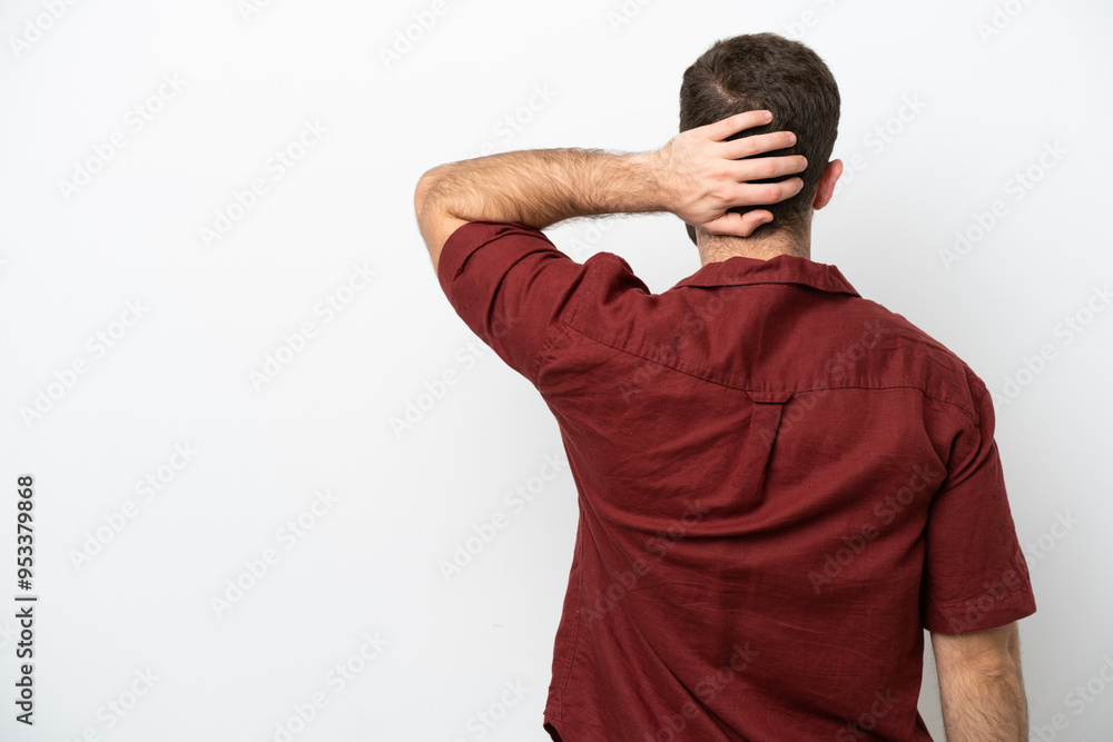 Young caucasian man isolated on white background in back position and thinking Young caucasian man isolated on white background in back position and thinking