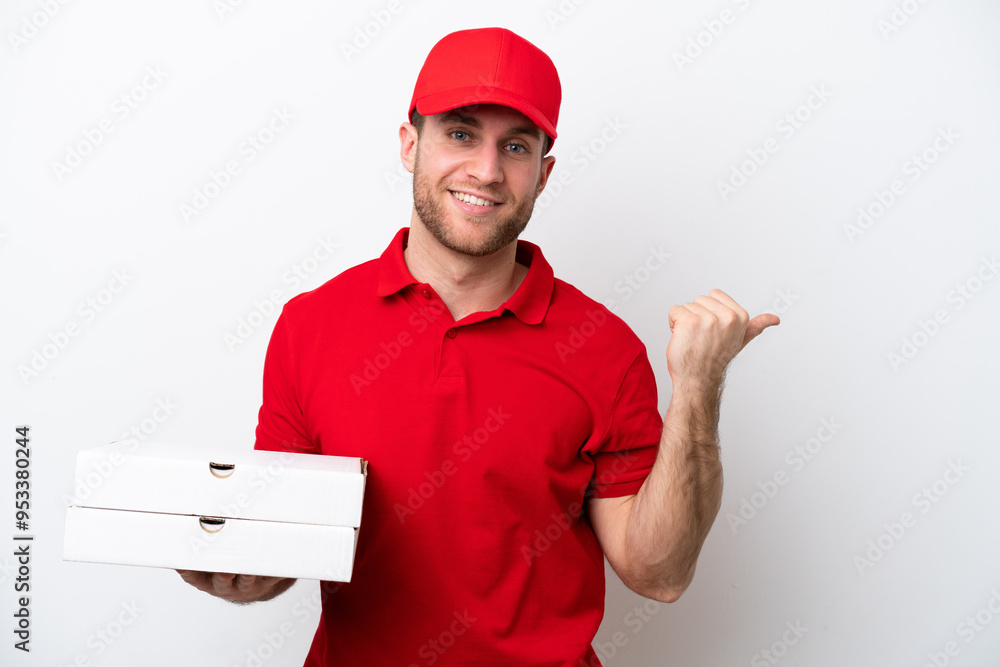 Pizza delivery caucasian man with work uniform picking up pizza boxes isolated on white background pointing to the side to present a product Pizza delivery caucasian man with work uniform picking up pizza boxes isolated on white background pointing to the side to present a product