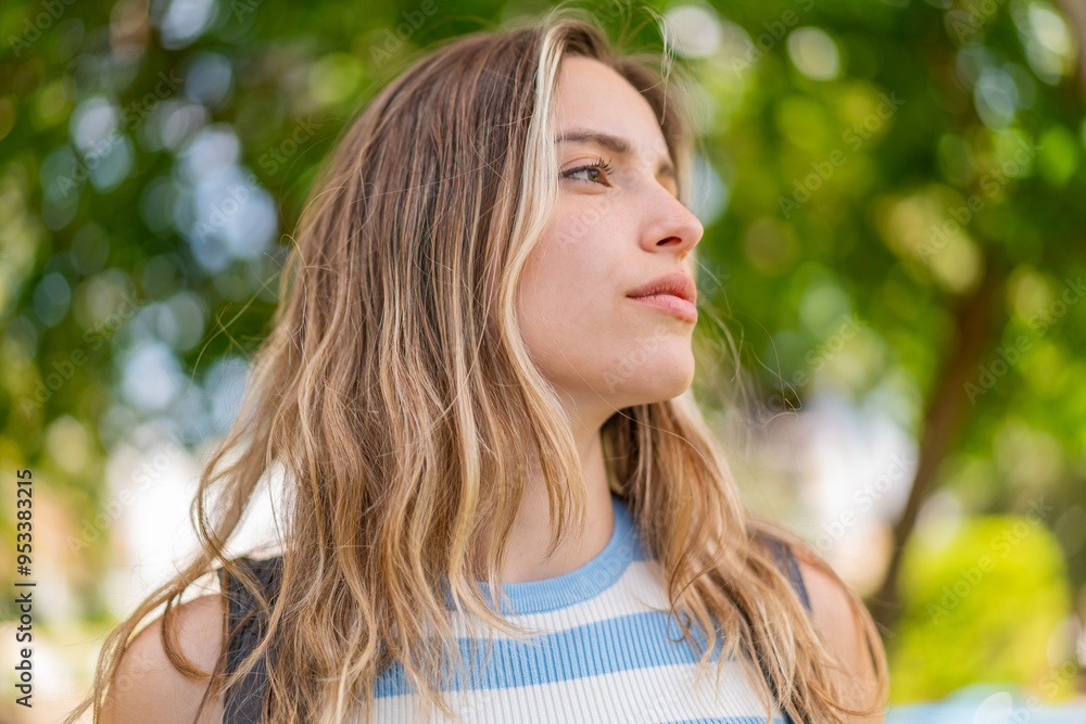 Young pretty woman at outdoors . Portrait Young pretty woman at outdoors . Portrait