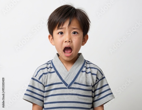 there is a young boy with a surprised look on his face.