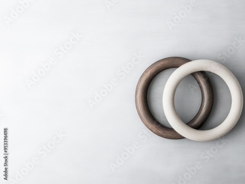 Minimalist interlocked wooden rings in earthy tones