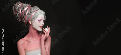 Cheerful beautiful woman in carnival Halloween costume, theater actress photo