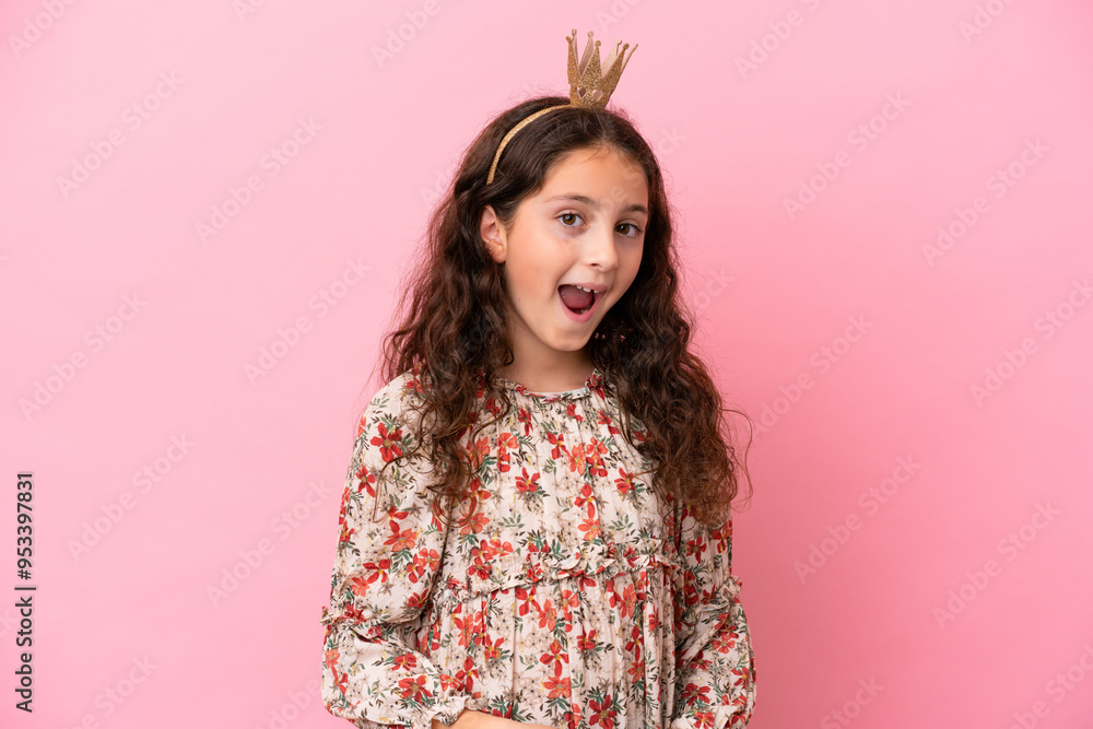 Little caucasian princess with crown isolated on pink background with surprise and shocked facial expression Little caucasian princess with crown isolated on pink background with surprise and shocked facial expression