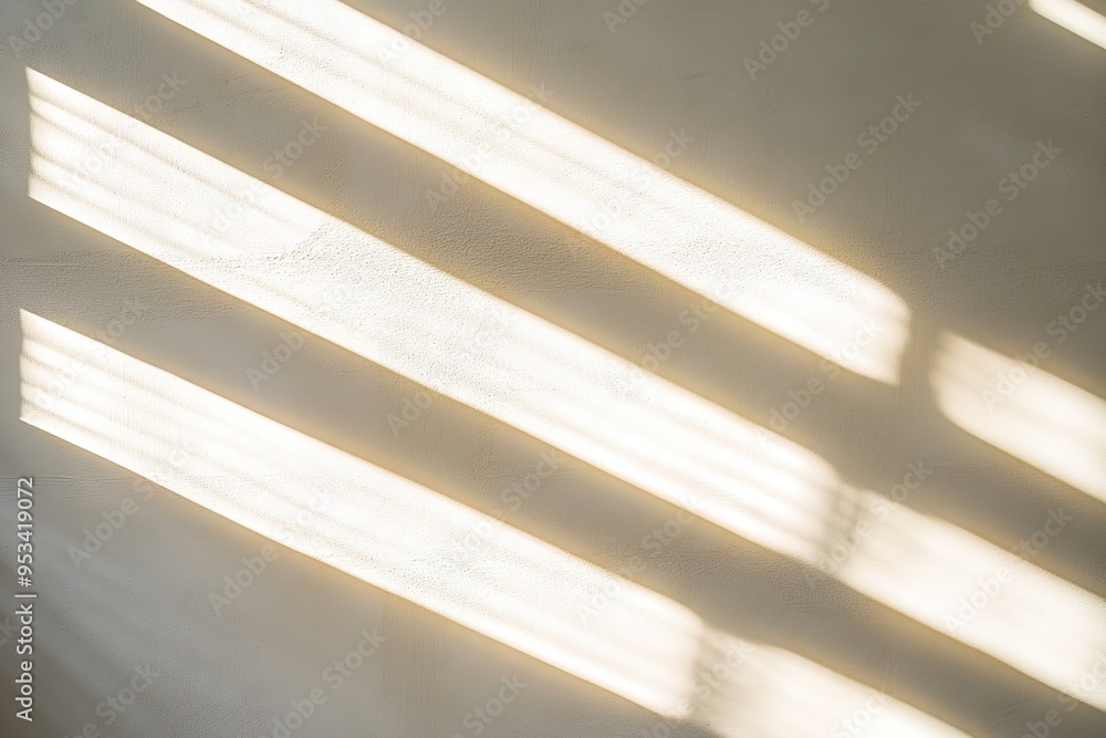 Obraz premium Sunlight casting stripes on a wall, soft shadows