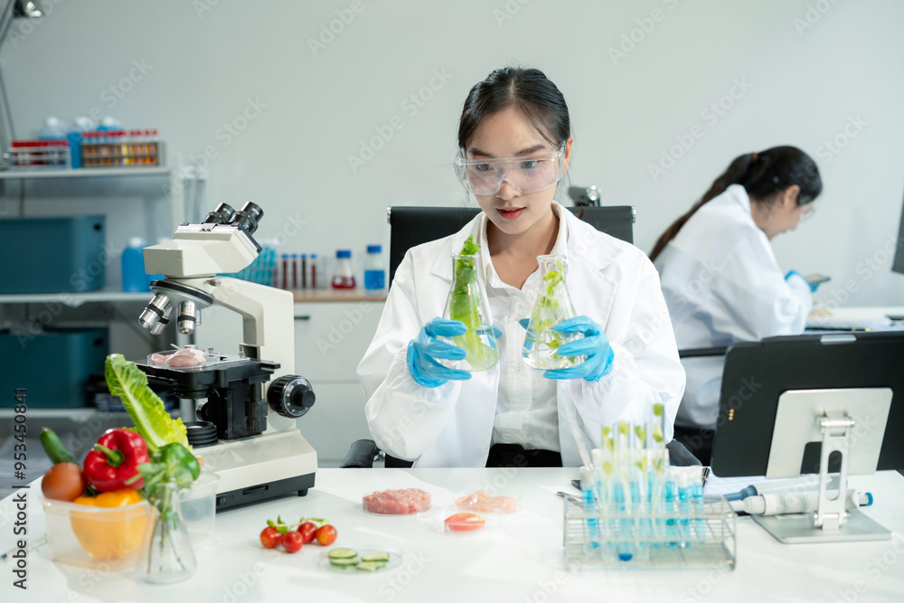 Eco laboratory microbiology. Sample in a Microscope and comparing a plant or herb in test tube or glassware. Natural product and meat. Eco laboratory microbiology. Sample in a Microscope and comparing a plant or herb in test tube or glassware. Natural product and meat.