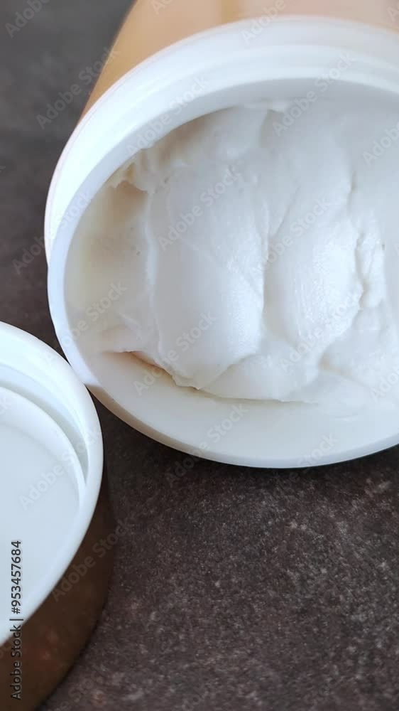 Jar of white cosmetic cream body butter. Face or body cream. Jar of white cosmetic cream body butter. Face or body cream.