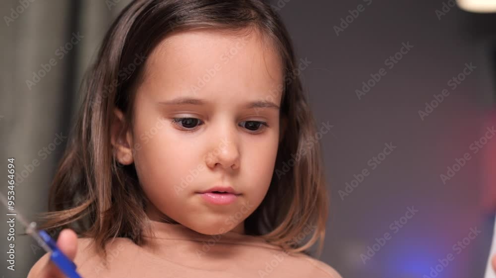 little girl makes a paper craft, draw with pencils, cut paper with scissors little girl makes a paper craft, draw with pencils, cut paper with scissors