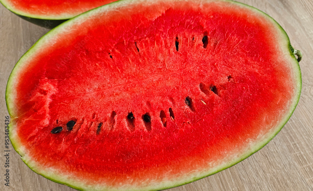 Close-up of cut ripe juicy red watermelon with seeds Close-up of cut ripe juicy red watermelon with seeds