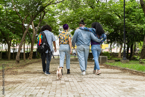 Fotografija LGBTQ group of good friends walking with their backs turned