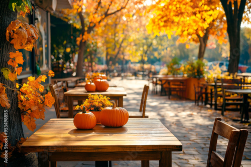 Outdoor cafe with pumpkins and flowers on wooden tables, bathed in warm autumn sunlight and surrounded by colorful fall foliage