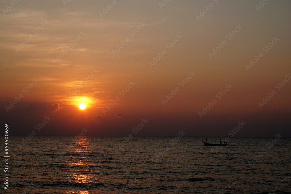 The perspective of the fishing boat in the sea with a sunrise background The perspective of the fishing boat in the sea with a sunrise background