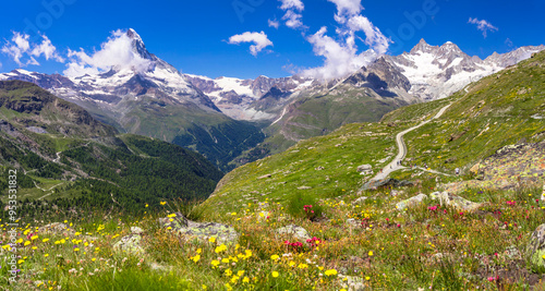 famous hiking routes in Switzerland , Valais canton - five most beautiful mountain lakes in Zermatt. scenic view of floral meadow and Matterhorn iconic mountain