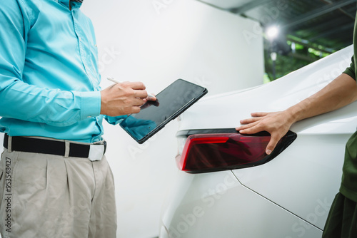 Car seller agent signs a car insurance agreement with salesman. The document outlines vehicle policy, premium, rental terms, with contract paper finalized using car insurance claim mobile phone.