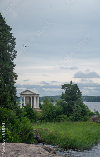 
High rocky shores above the water surface. There are mixed forests around.