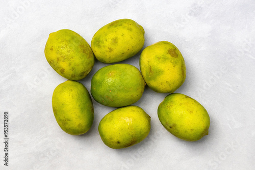 Fresh ripe lemons on white background. Top view. photo