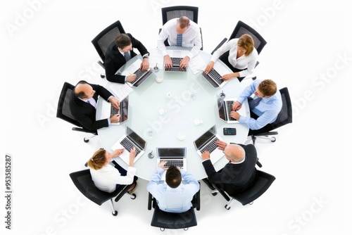 Business professionals meeting around table with laptops