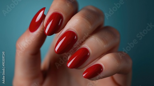 Close up of hand with red nail polish