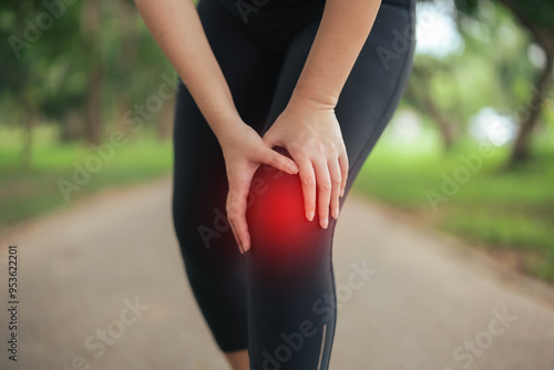 A woman is hurting her knee after running. Health problem concept, osteoarthritis problem. Running hard until injured.