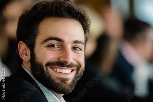 Businessman with a joyful expression, captured in a close-up shot smilling