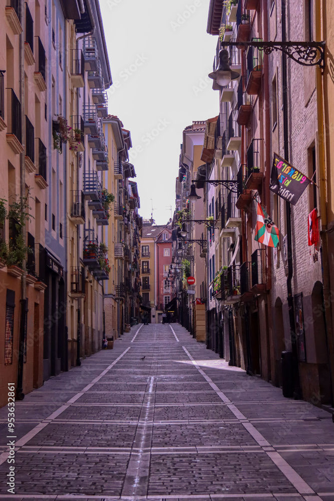 Fototapeta premium Beautiful narrow spanish ancient street with a modern tropical look