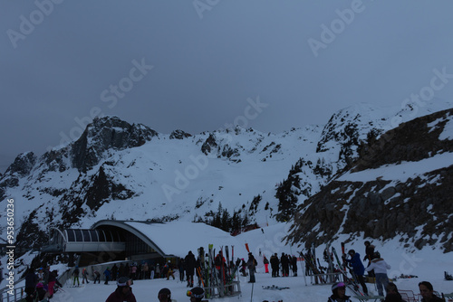 Panorama of the ski resort in alps. drama sky, mountain peaks, ski lift, skiers. high resolution photo.