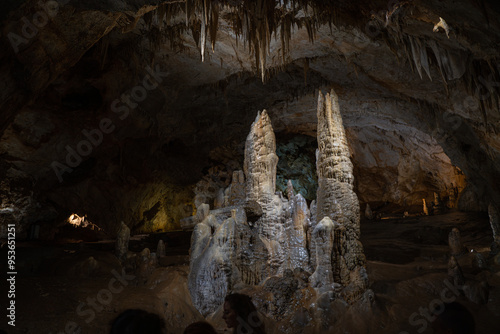 Stalagmites in the cave with light.