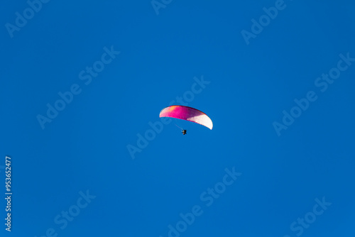 Paraplan and deltaplan in alps over a ski resort