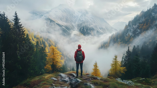 A lone hiker stands on a ro...
