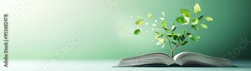 An open book with a green plant growing from its pages, symbolizing knowledge and growth in a serene setting.