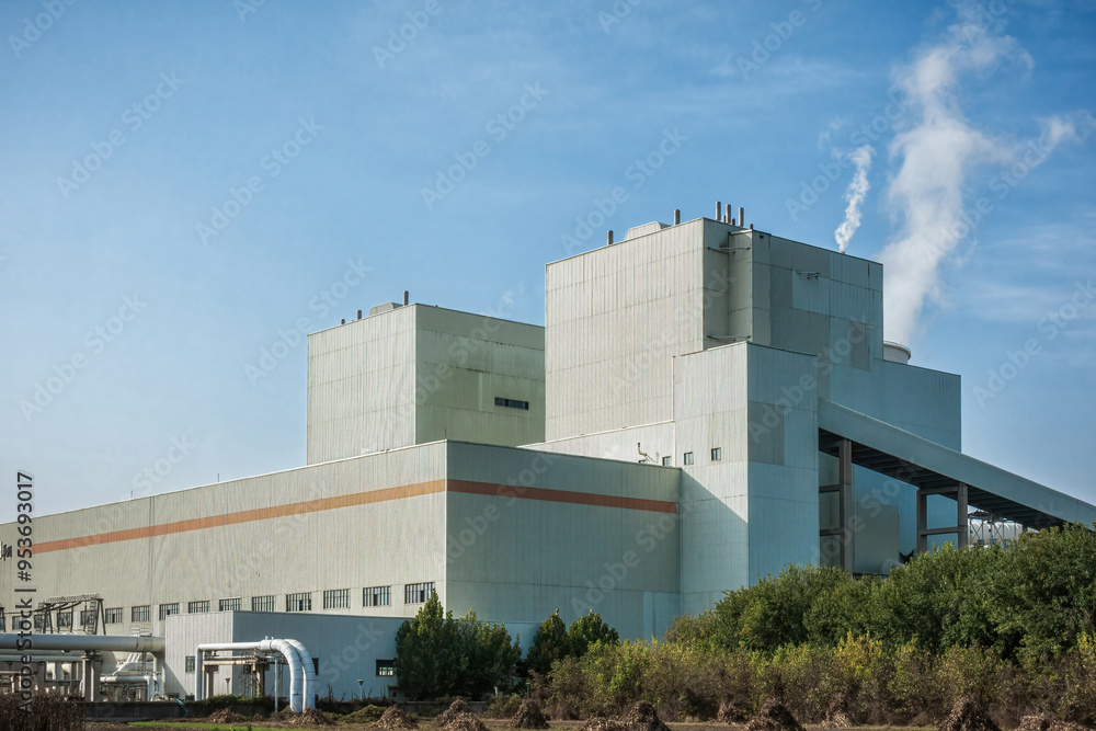Power Station Cooling Towers Emitting Steam into Clear Sky Power Station Cooling Towers Emitting Steam into Clear Sky