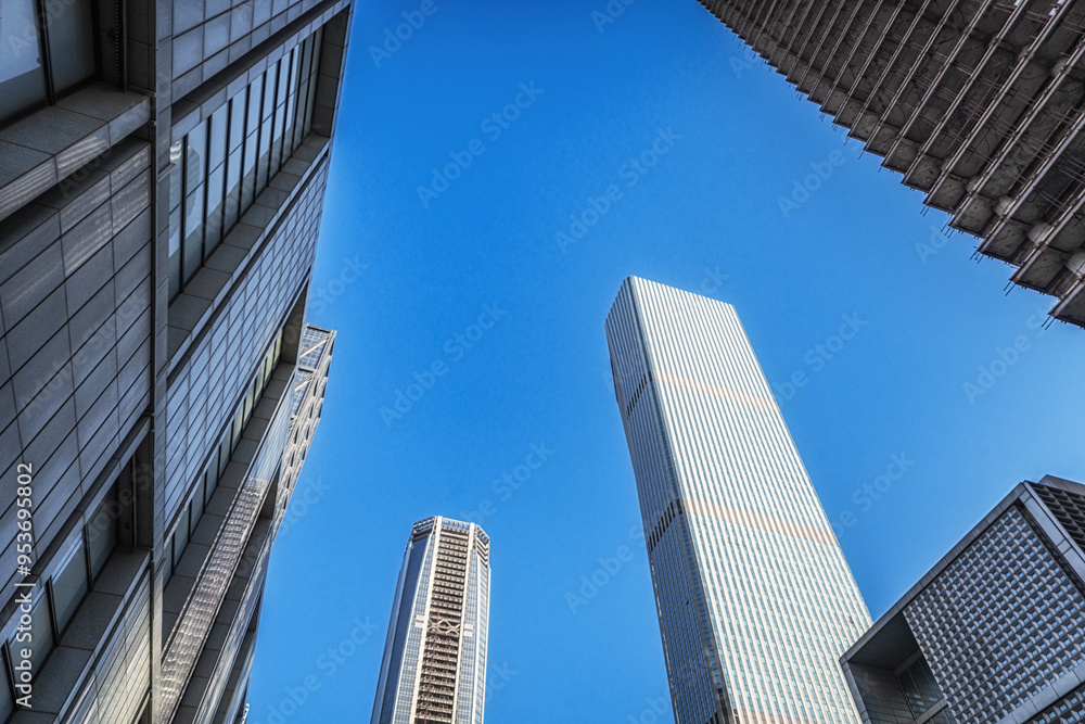 Towering Skyscrapers Reaching Up to the Blue Sky Towering Skyscrapers Reaching Up to the Blue Sky