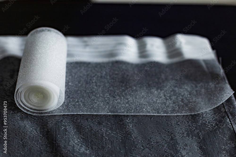 Obraz premium installing eyelets in curtain