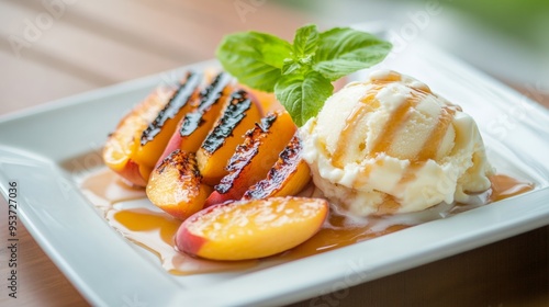 Juicy grilled peaches with honey drizzle served with vanilla ice cream