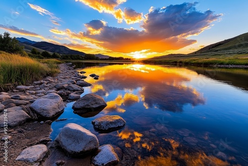 Amazing Sunset Clouds, Reflection, and Romantic depicted in a romantic scene where the sunset reflects on a calm river, with clouds adding texture and depth to the skyâ€™s vibrant colors