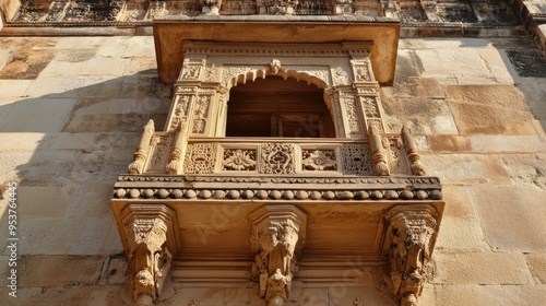 A beautifully carved sandstone jharokha (balcony) on the facade of an ancient Indian fort photo